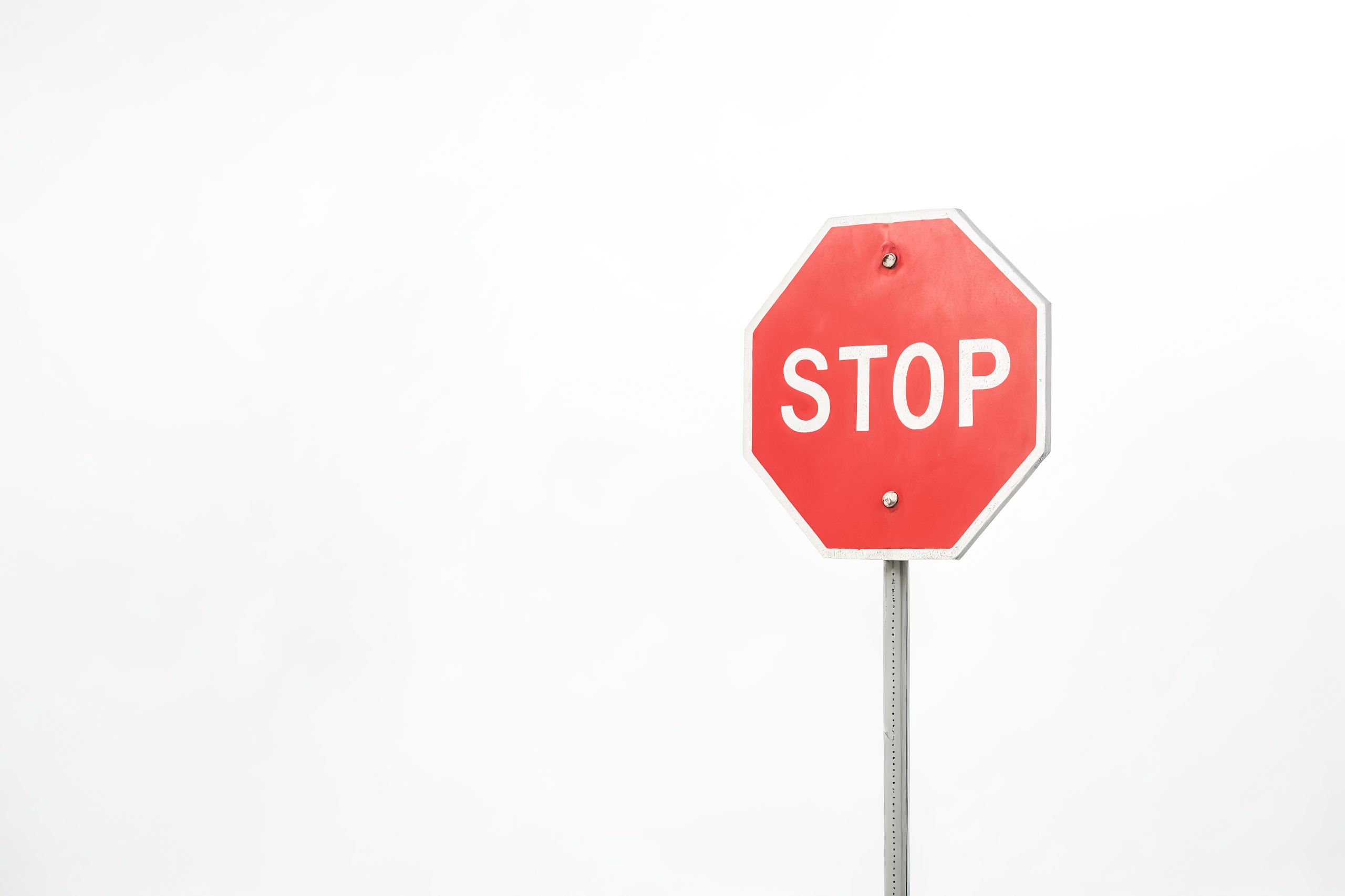 Red Stop Sign Against White Background